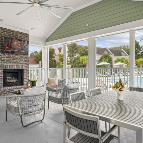 Exterior lounge area with fire pit and seating Exterior lounge area with fire pit and seating