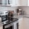 a kitchen with white cabinets